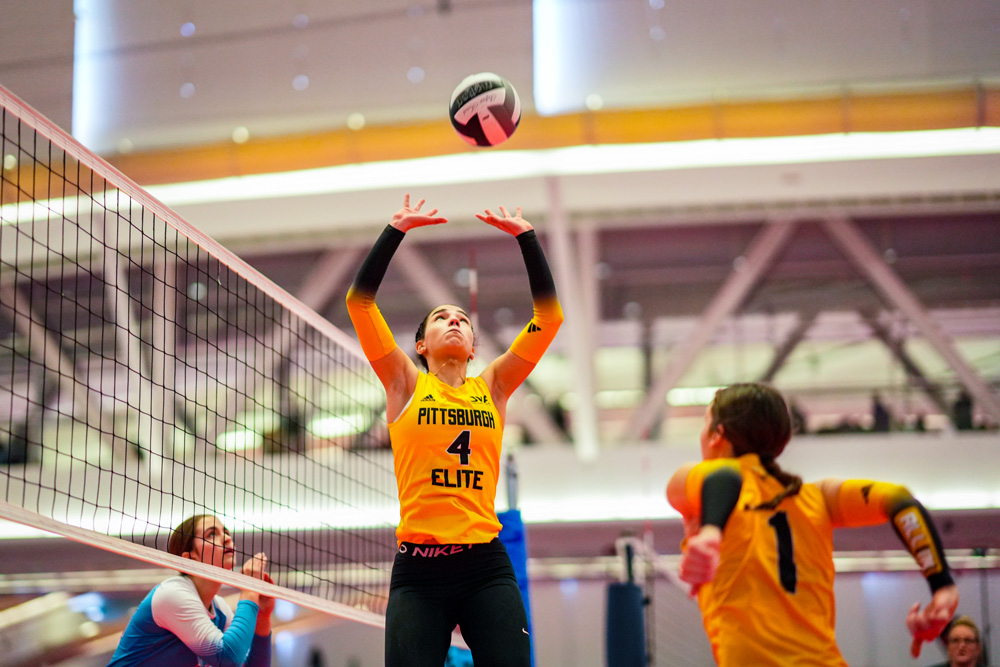 Camdynn setting the ball to her teammate for a spike