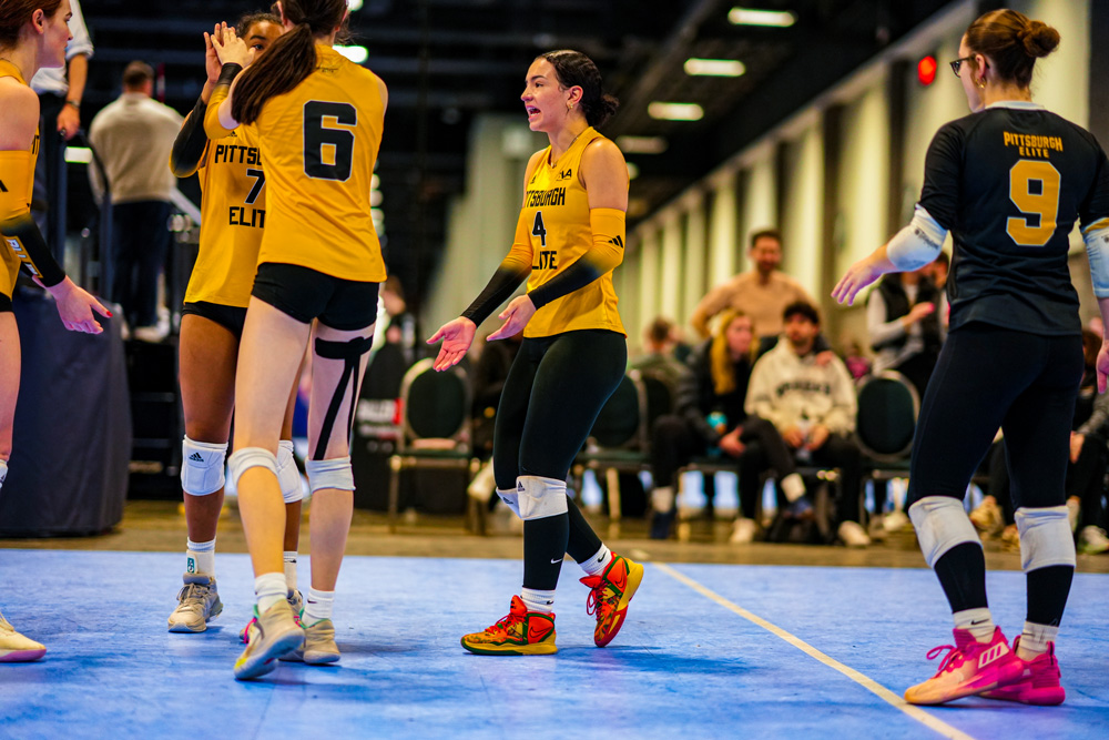 Camdynn going in for high fives with her teammates